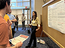 Michelle presenting at the undergraduate research poster session, August 2023